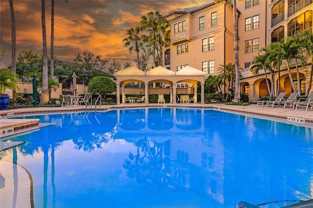 500 Mirasol Cir Unit 203, Celebration, FL 34747 - pool at dusk with a community pool