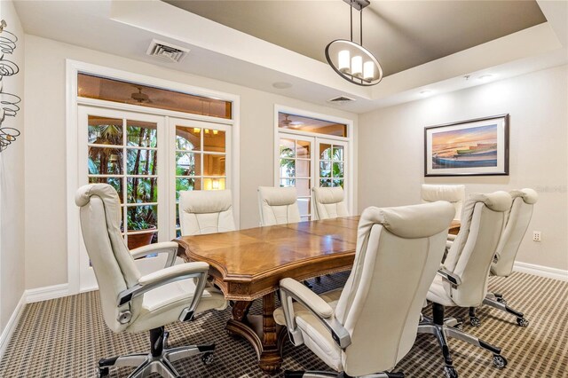 500 Mirasol Cir Unit 203, Celebration, FL 34747 - carpeted dining room featuring baseboards, a desk, and a tray ceiling