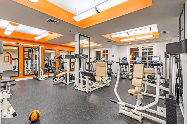 500 Mirasol Cir Unit 203, Celebration, FL 34747 - exercise room with a tray ceiling