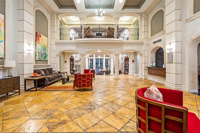 500 Mirasol Cir Unit 203, Celebration, FL 34747 - community lobby featuring a towering ceiling, coffered ceiling, crown molding, and beamed ceiling