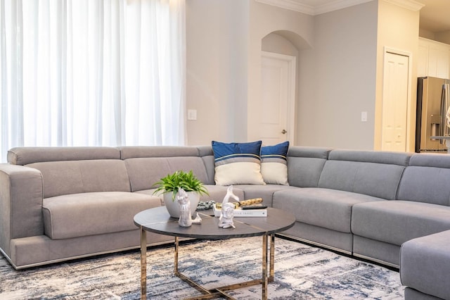 8964 Takeaway Way, Davenport, FL 33896 - living room featuring crown molding and arched walkways