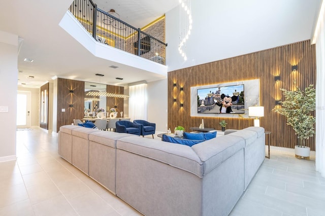 8964 Takeaway Way, Davenport, FL 33896 - living area with light tile patterned flooring, wooden walls, and a towering ceiling