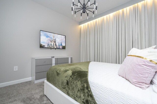 8964 Takeaway Way, Davenport, FL 33896 - bedroom featuring a chandelier, carpet flooring, and baseboards