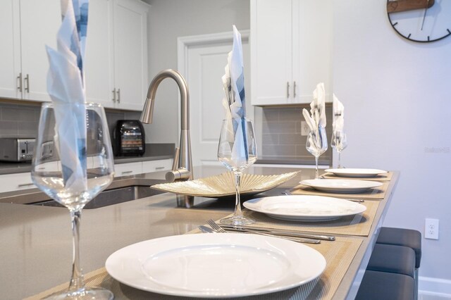 8964 Takeaway Way, Davenport, FL 33896 - dining area view of tasteful backsplash and a sink