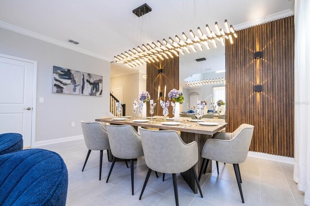 8964 Takeaway Way, Davenport, FL 33896 - dining area with crown molding, baseboards, stairs, and light tile patterned floors