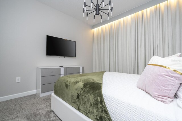 8964 Takeaway Way, Davenport, FL 33896 - bedroom with a chandelier, light carpet, and baseboards
