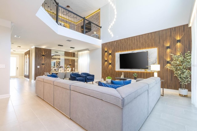8964 Takeaway Way, Davenport, FL 33896 - living area featuring light tile patterned floors, wooden walls, and a high ceiling
