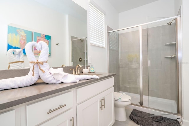 8964 Takeaway Way, Davenport, FL 33896 - bathroom with vanity, toilet, a stall shower, and tile patterned flooring