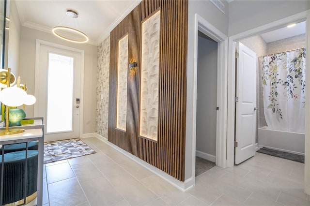 8964 Takeaway Way, Davenport, FL 33896 - foyer featuring crown molding, healthy amount of natural light, tile patterned floors, and baseboards