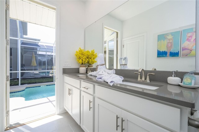 8964 Takeaway Way, Davenport, FL 33896 - bathroom with double vanity and tile patterned floors