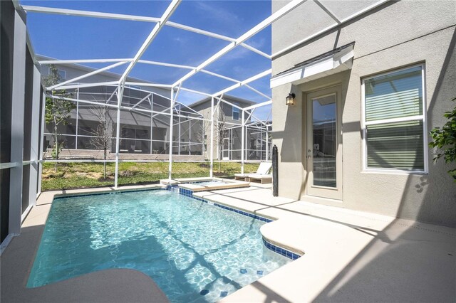8964 Takeaway Way, Davenport, FL 33896 - view of swimming pool featuring a patio area, a lanai, and a pool with connected hot tub