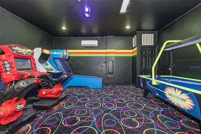 1403 Rolling Fairway Dr, Davenport, FL 33896 - playroom with concrete block wall, an AC wall unit, and carpet flooring