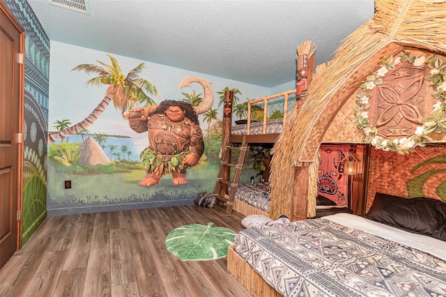 1403 Rolling Fairway Dr, Davenport, FL 33896 - bedroom with wood finished floors and a textured ceiling