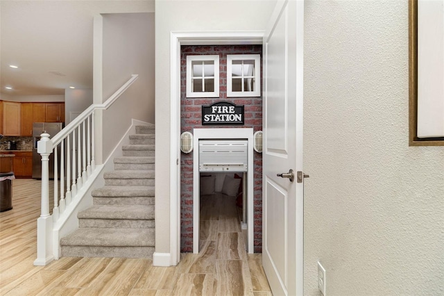 1403 Rolling Fairway Dr, Davenport, FL 33896 - stairway featuring wood finished floors, recessed lighting, and baseboards