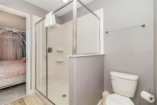 1403 Rolling Fairway Dr, Davenport, FL 33896 - ensuite bathroom featuring a shower stall, wood finished floors, and toilet