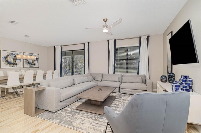 1403 Rolling Fairway Dr, Davenport, FL 33896 - living area featuring wood finished floors and ceiling fan