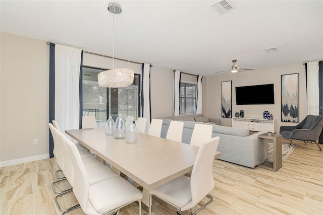 1403 Rolling Fairway Dr, Davenport, FL 33896 - dining room featuring ceiling fan, wood finished floors, and baseboards