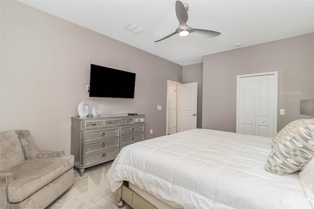 1403 Rolling Fairway Dr, Davenport, FL 33896 - bedroom with light colored carpet, a closet, and ceiling fan