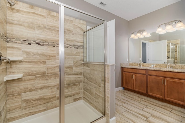 1403 Rolling Fairway Dr, Davenport, FL 33896 - bathroom featuring a shower stall, double vanity, and wood tiled floors