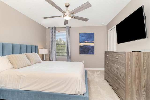 1403 Rolling Fairway Dr, Davenport, FL 33896 - bedroom with light carpet, baseboards, and a ceiling fan