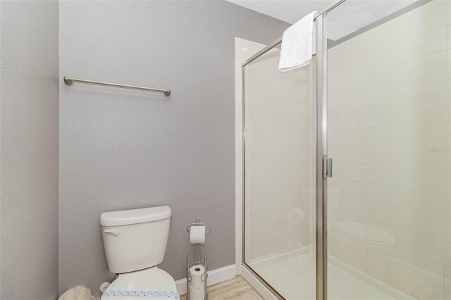 1403 Rolling Fairway Dr, Davenport, FL 33896 - bathroom with toilet, a stall shower, and baseboards