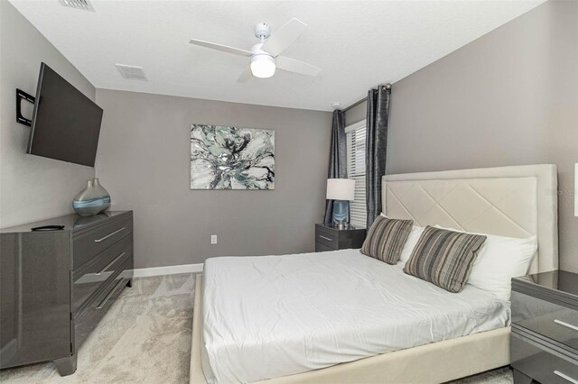 1403 Rolling Fairway Dr, Davenport, FL 33896 - bedroom with light colored carpet, a ceiling fan, and baseboards