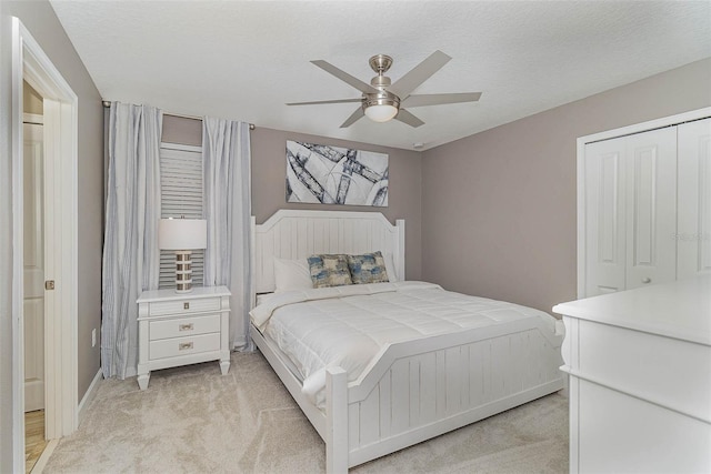 1403 Rolling Fairway Dr, Davenport, FL 33896 - bedroom with light carpet, a closet, ceiling fan, and baseboards