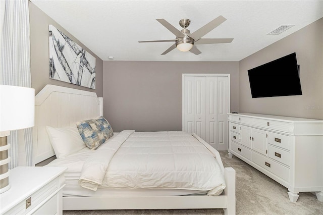 1403 Rolling Fairway Dr, Davenport, FL 33896 - bedroom with light colored carpet, a closet, and a ceiling fan