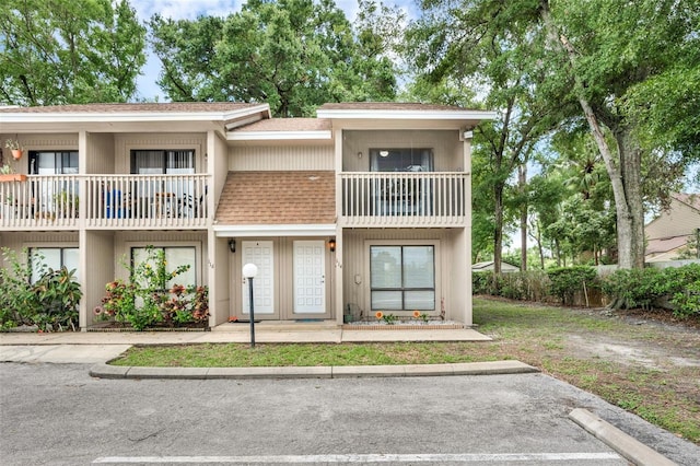 752 Howland Ln Unit 114, Altamonte Springs, FL 32701 - townhome / multi-family property featuring a balcony and a shingled roof