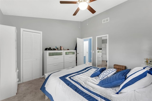 752 Howland Ln Unit 114, Altamonte Springs, FL 32701 - bedroom featuring light carpet, a closet, a high ceiling, and ceiling fan