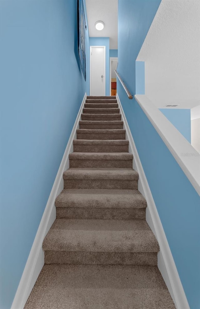 752 Howland Ln Unit 114, Altamonte Springs, FL 32701 - stairs with carpet floors