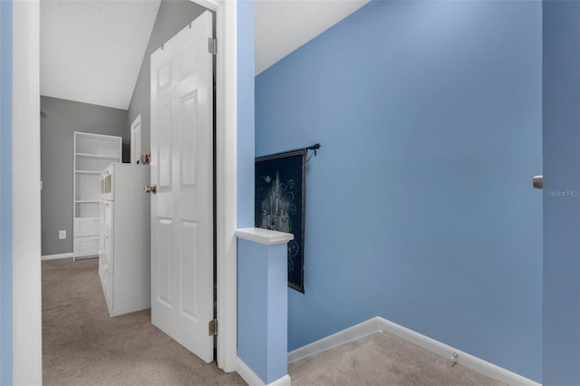 752 Howland Ln Unit 114, Altamonte Springs, FL 32701 - hall with carpet floors, baseboards, and lofted ceiling