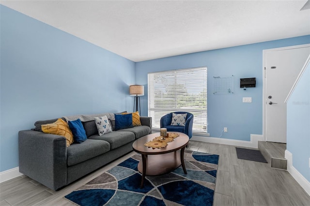 752 Howland Ln Unit 114, Altamonte Springs, FL 32701 - living area with light wood-style flooring and baseboards