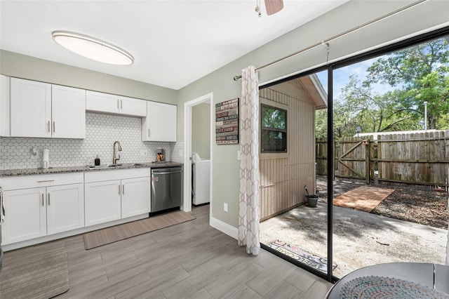 752 Howland Ln Unit 114, Altamonte Springs, FL 32701 - kitchen with a sink, dishwasher, backsplash, light stone counters, and white cabinets