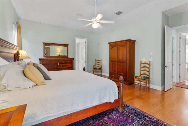 3372 Bellington Dr, Orlando, FL 32835 - bedroom with wood finished floors, baseboards, and a ceiling fan