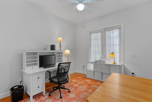 3372 Bellington Dr, Orlando, FL 32835 - office with baseboards, light wood-style floors, and ceiling fan