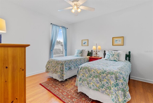 3372 Bellington Dr, Orlando, FL 32835 - bedroom featuring wood finished floors, baseboards, and a ceiling fan