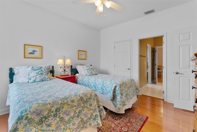 3372 Bellington Dr, Orlando, FL 32835 - bedroom featuring light wood-style floors, a ceiling fan, and baseboards