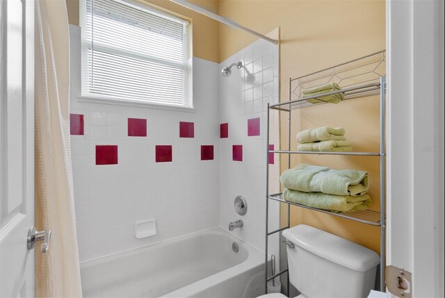 3372 Bellington Dr, Orlando, FL 32835 - bathroom featuring shower / bath combo and toilet