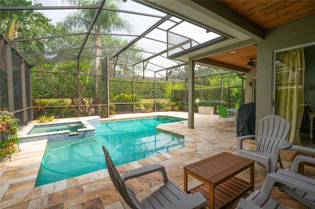 3372 Bellington Dr, Orlando, FL 32835 - view of pool featuring a patio area, a pool with connected hot tub, and a lanai
