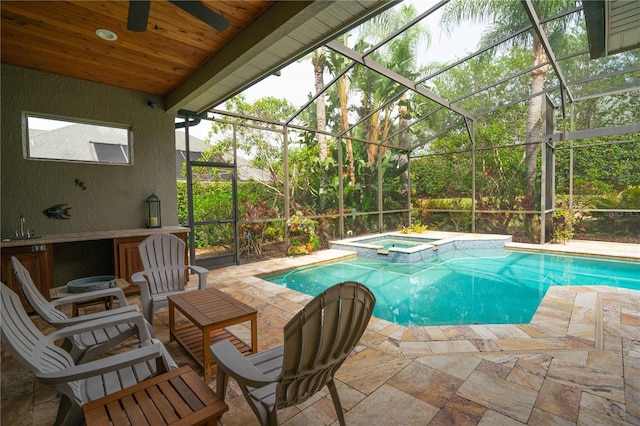 3372 Bellington Dr, Orlando, FL 32835 - view of pool featuring a patio area, a sink, a pool with connected hot tub, and a lanai