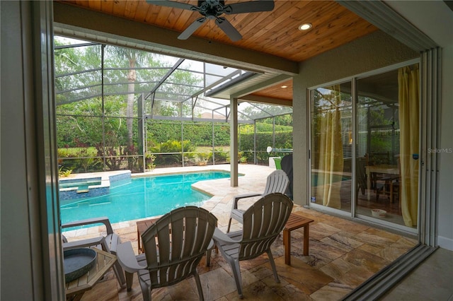 3372 Bellington Dr, Orlando, FL 32835 - view of swimming pool with a ceiling fan, a pool with connected hot tub, a patio area, and a lanai