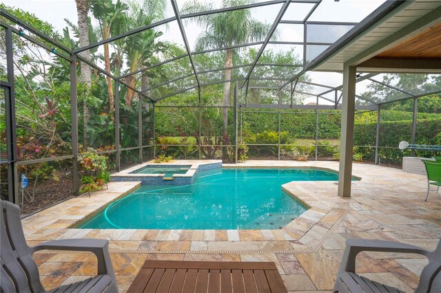 3372 Bellington Dr, Orlando, FL 32835 - view of pool with a lanai, a patio, and a pool with connected hot tub