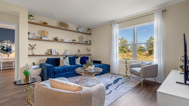 3141 Partington Blvd, Davenport, FL 33837 - living room with wood finished floors