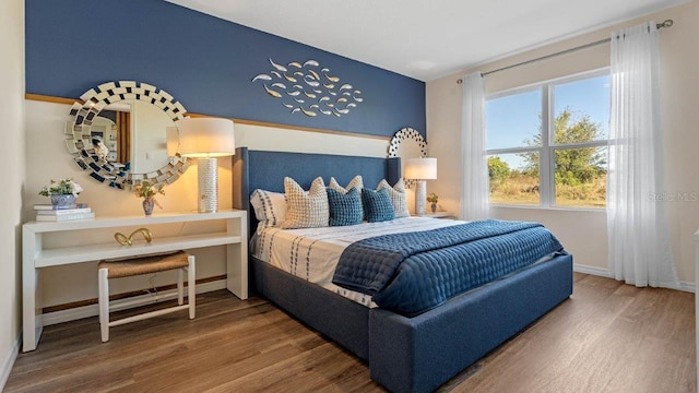 3141 Partington Blvd, Davenport, FL 33837 - bedroom with wood finished floors and baseboards