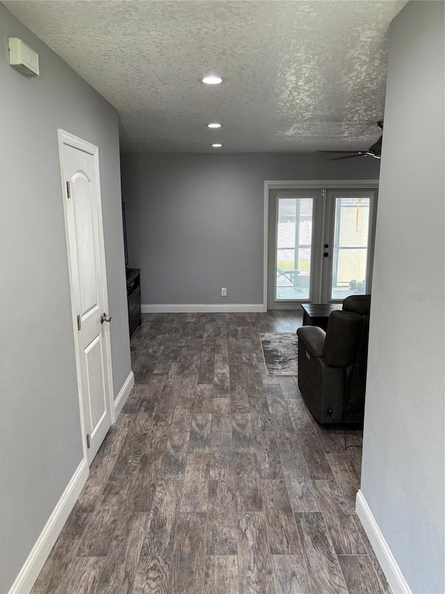 9471 Comeau St, Gotha, FL 34734 - hall featuring wood finished floors, a textured ceiling, baseboards, and recessed lighting