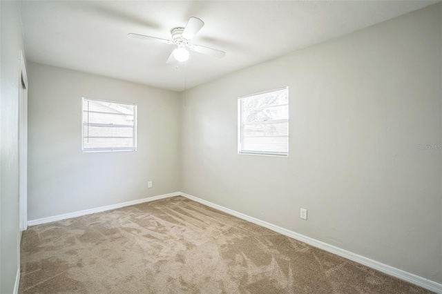 2307 Freemason St, Lakeland, FL 33801 - carpeted spare room featuring baseboards and a ceiling fan