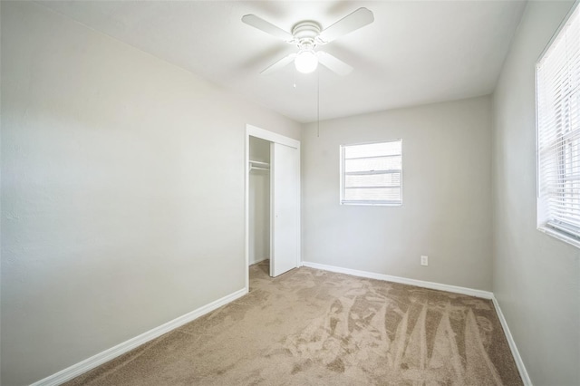 2307 Freemason St, Lakeland, FL 33801 - unfurnished bedroom featuring carpet, multiple windows, and a closet