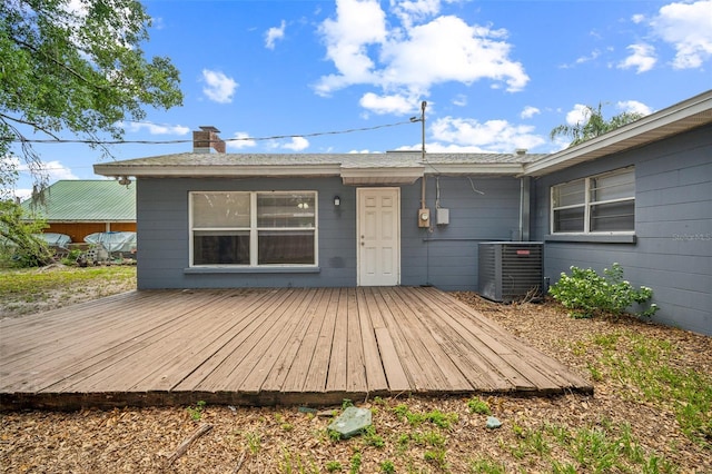 2307 Freemason St, Lakeland, FL 33801 - rear view of house with a wooden deck and a chimney