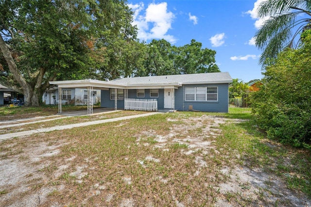 2307 Freemason St, Lakeland, FL 33801 - ranch-style house featuring an attached carport and driveway